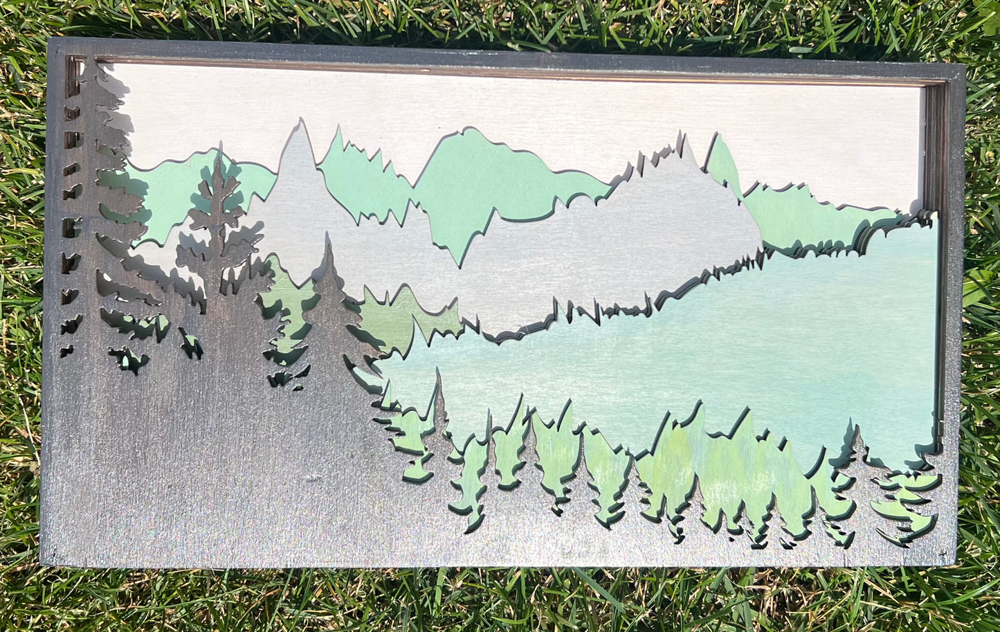 Layered mountain sign